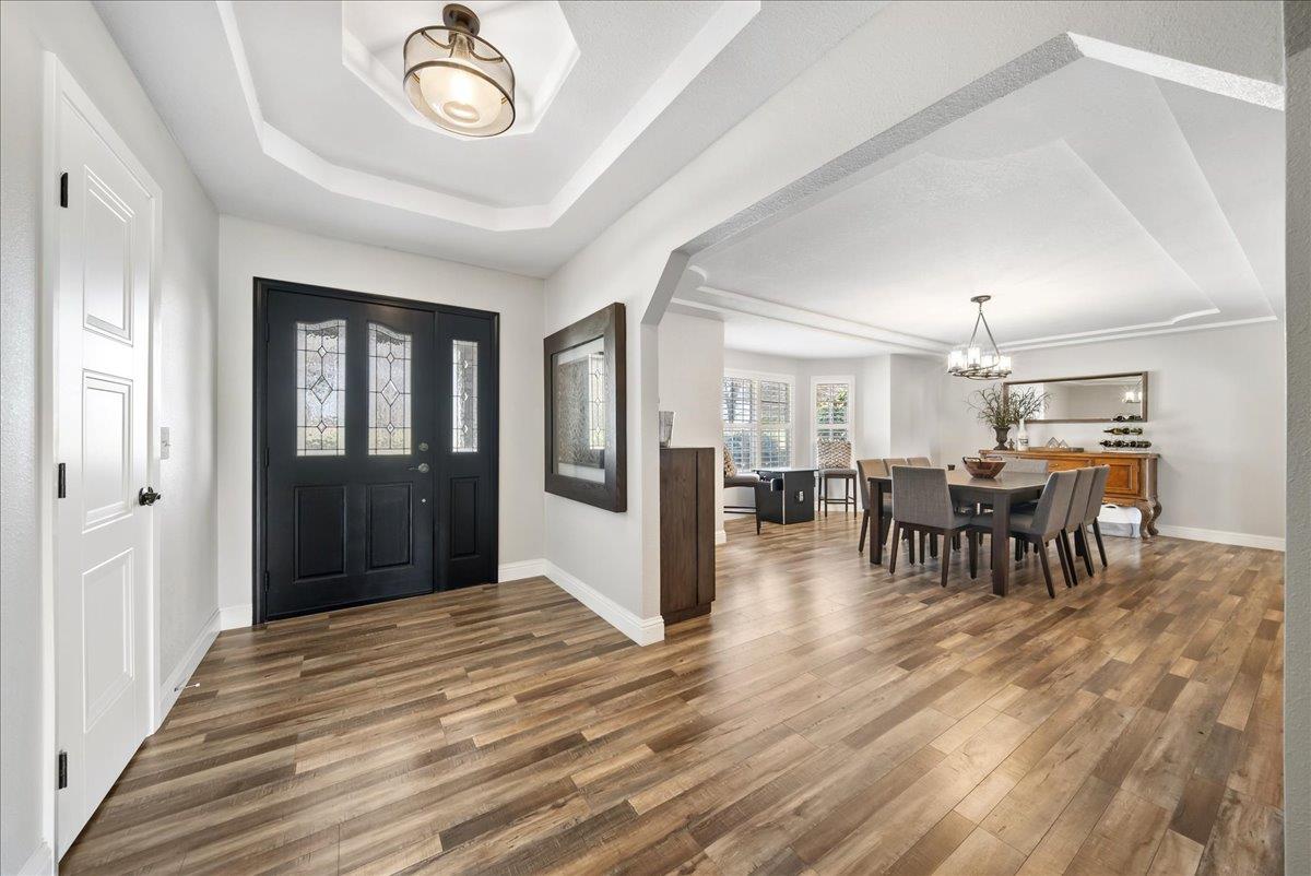 9777 Tavernor Road Wilton, CA 95693 - Photo 5 of 59 a view of a dining room with furniture window and wooden floor