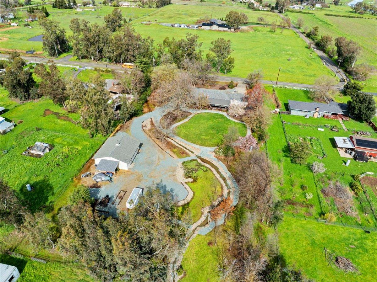 9777 Tavernor Road Wilton, CA 95693 - Photo 58 of 59 an aerial view of a house with a yard swimming pool patio and lake view