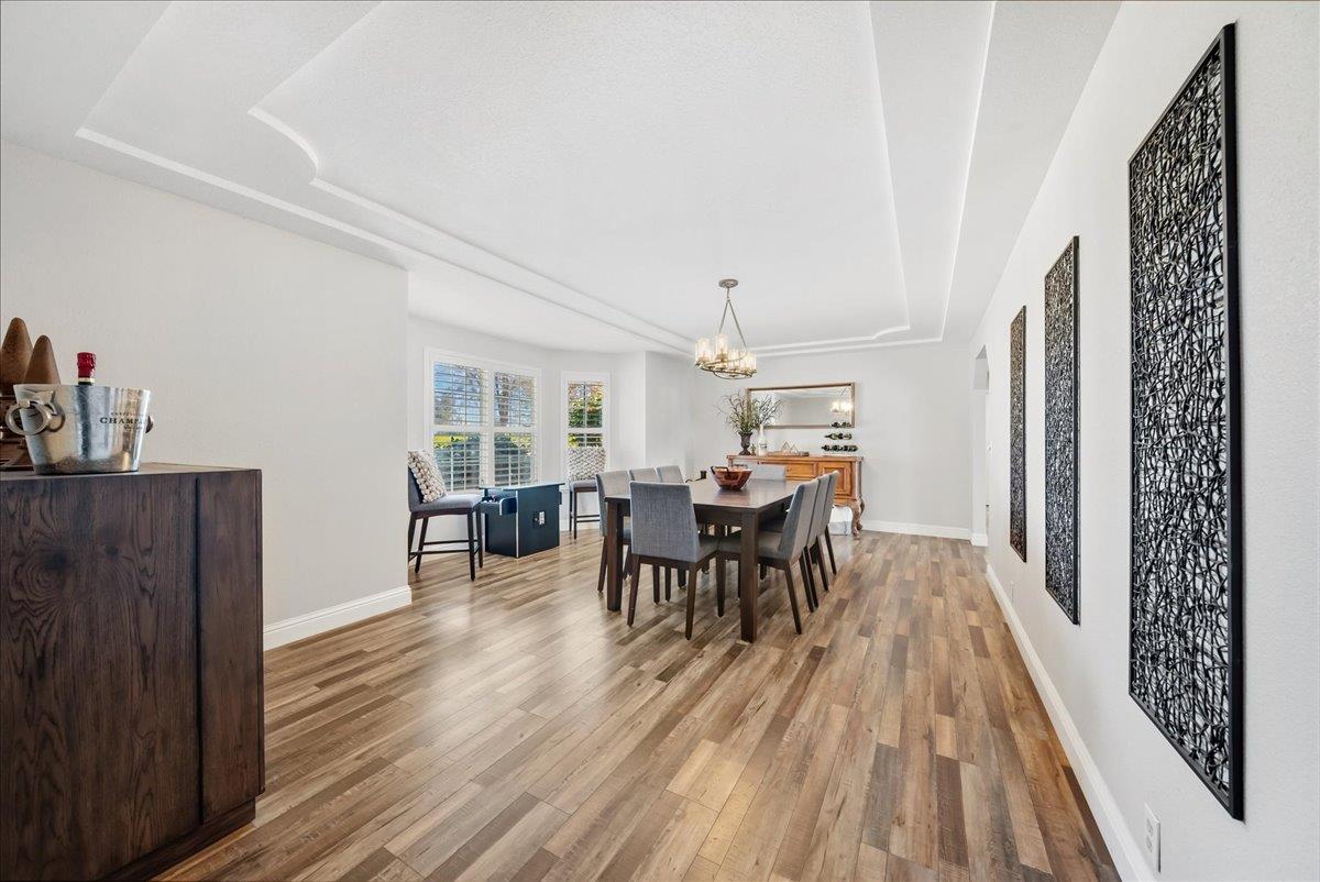 9777 Tavernor Road Wilton, CA 95693 - Photo 6 of 59 a view of a dining room with furniture and wooden floor