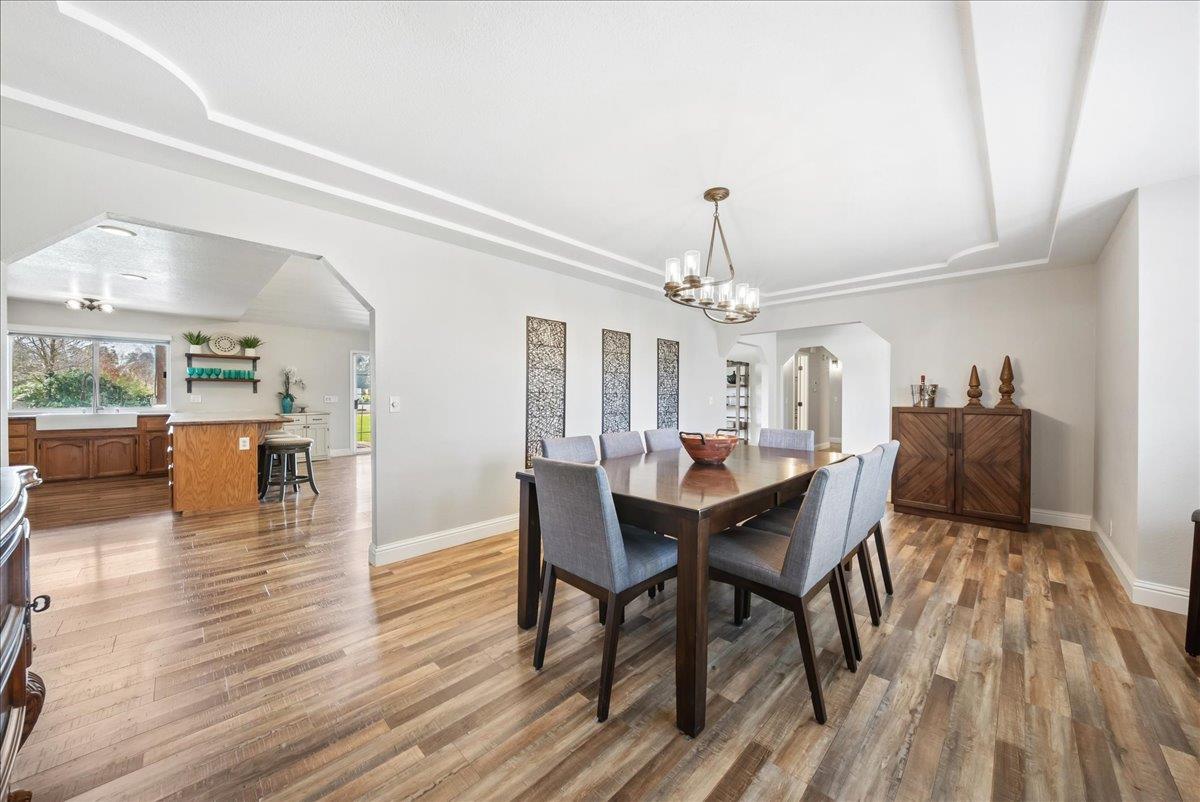 9777 Tavernor Road Wilton, CA 95693 - Photo 8 of 59 a view of a dining room with furniture and wooden floor