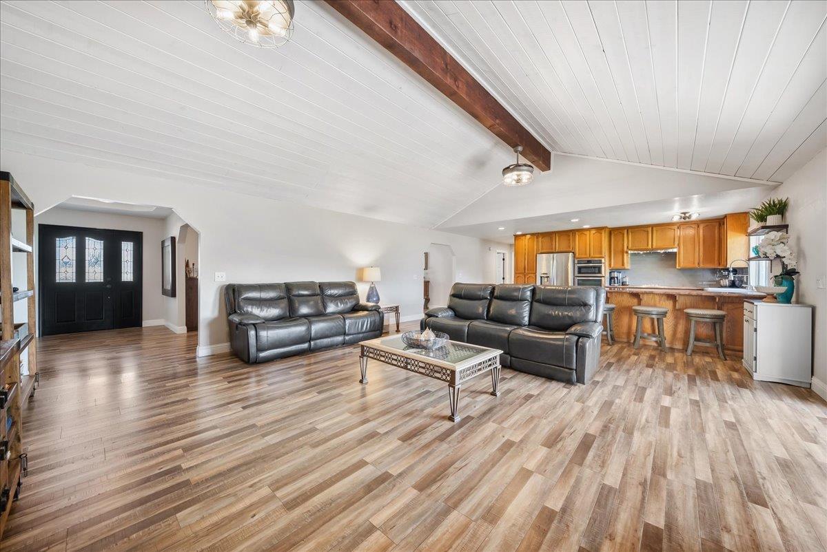 9777 Tavernor Road Wilton, CA 95693 - Photo 10 of 59 a living room with furniture and a wooden floor