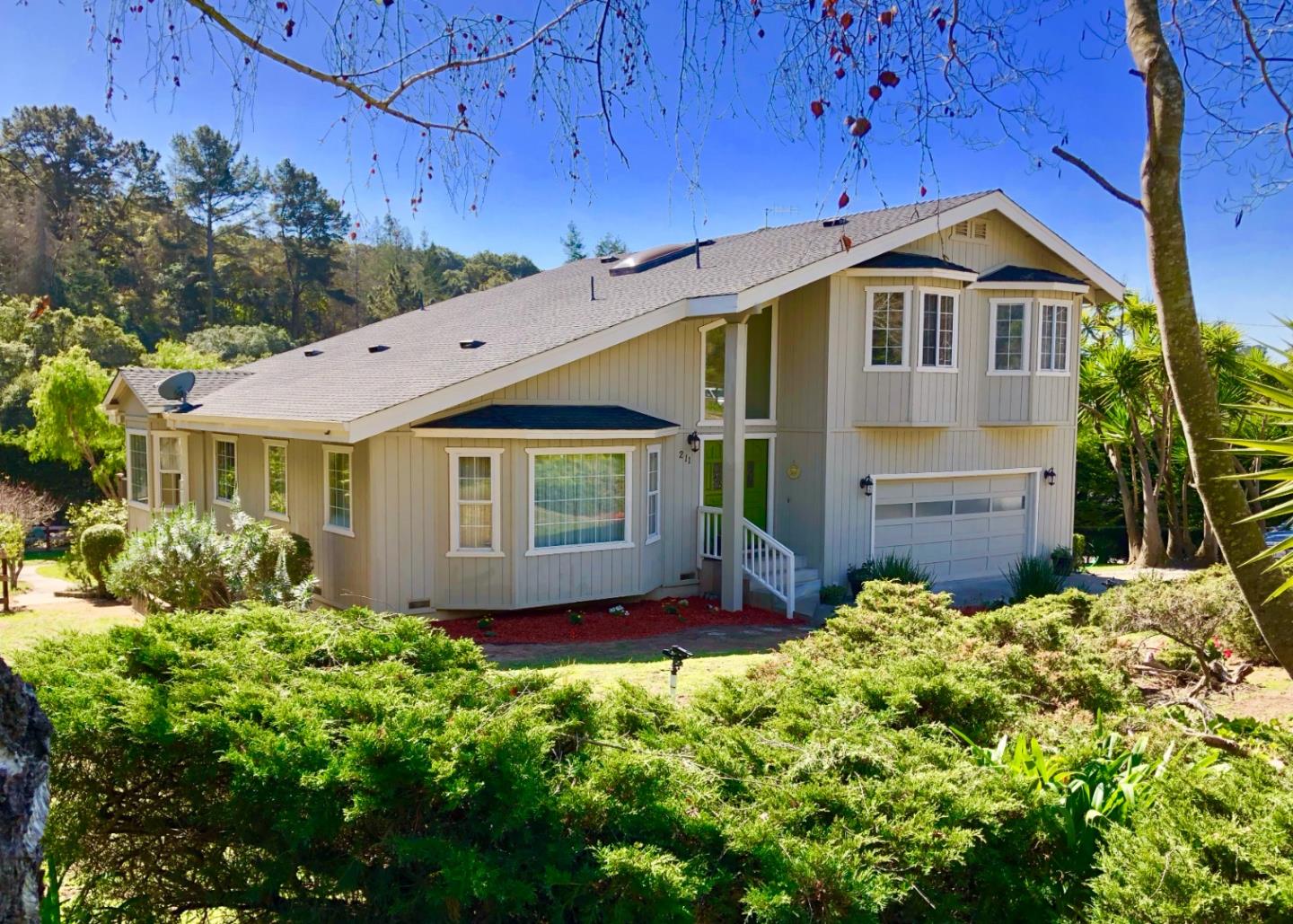 a front view of a house with a yard