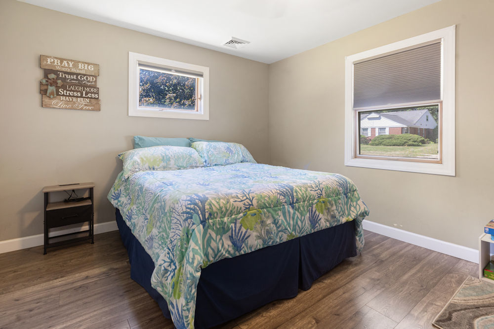 1067 North Main Street Rochelle, IL 61068 - Photo 13 of 18 a bed sitting in a bedroom next to a window