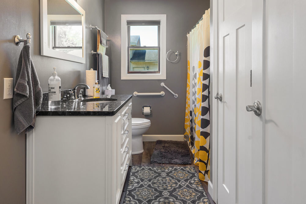 1067 North Main Street Rochelle, IL 61068 - Photo 15 of 18 a bathroom with a sink toilet and shower
