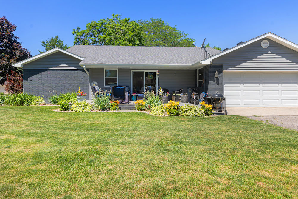 1067 North Main Street Rochelle, IL 61068 - Photo 16 of 18 a front view of house with yard and outdoor seating