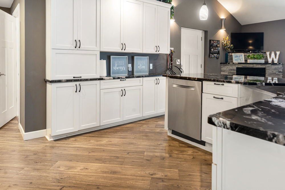 1067 North Main Street Rochelle, IL 61068 - Photo 4 of 18 a kitchen with stainless steel appliances granite countertop a refrigerator sink and white cabinets