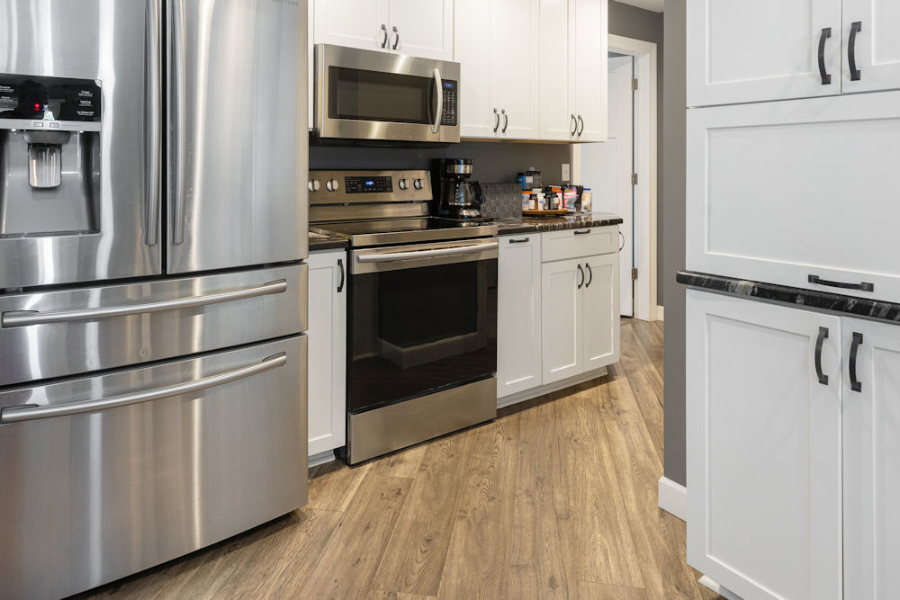 1067 North Main Street Rochelle, IL 61068 - Photo 5 of 18 a kitchen with stainless steel appliances a refrigerator stove and microwave