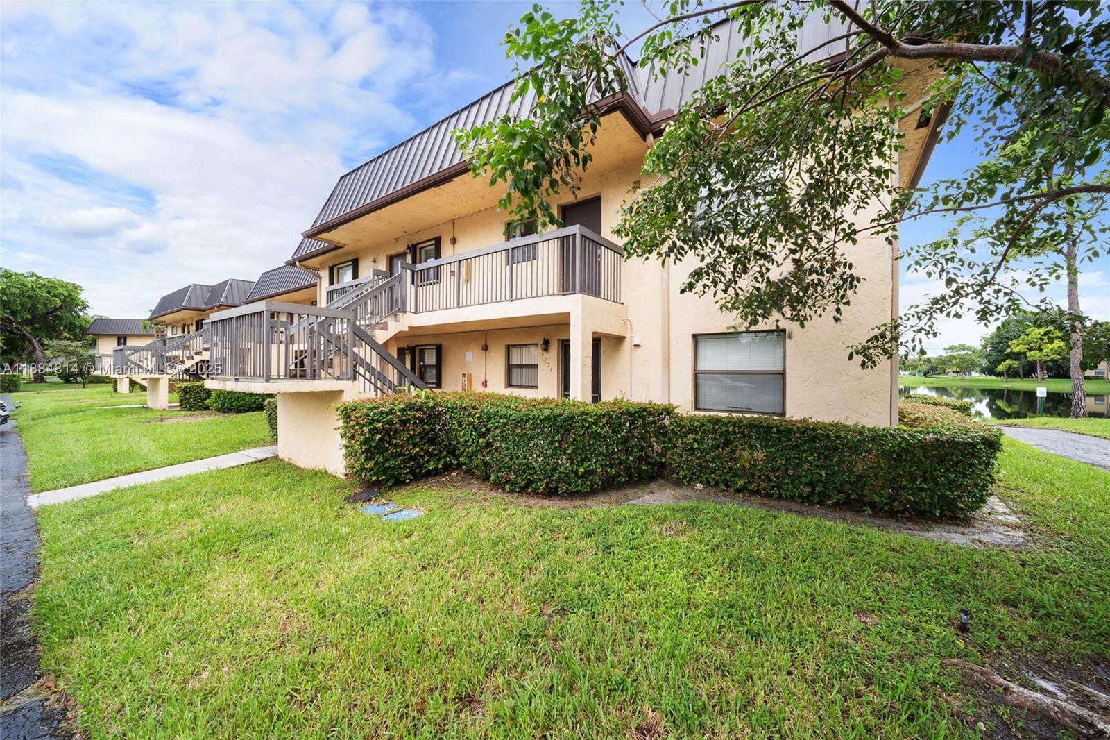 9258 Northwest 1st Street, Unit 206 Pembroke Pines, FL 33024 - Photo 1 of 22 a view of a house with a yard