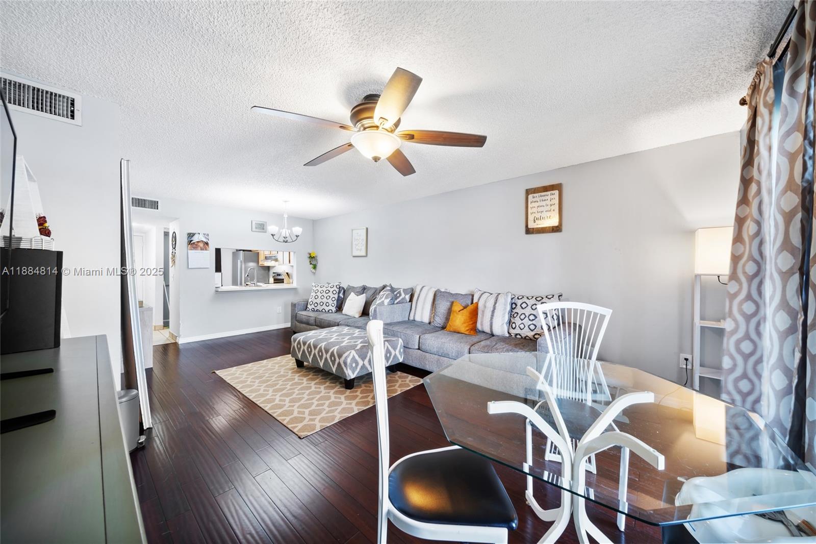 9258 Northwest 1st Street, Unit 206 Pembroke Pines, FL 33024 - Photo 11 of 22 a living room with furniture and wooden floor