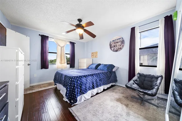 a bedroom with a bed furniture and a window