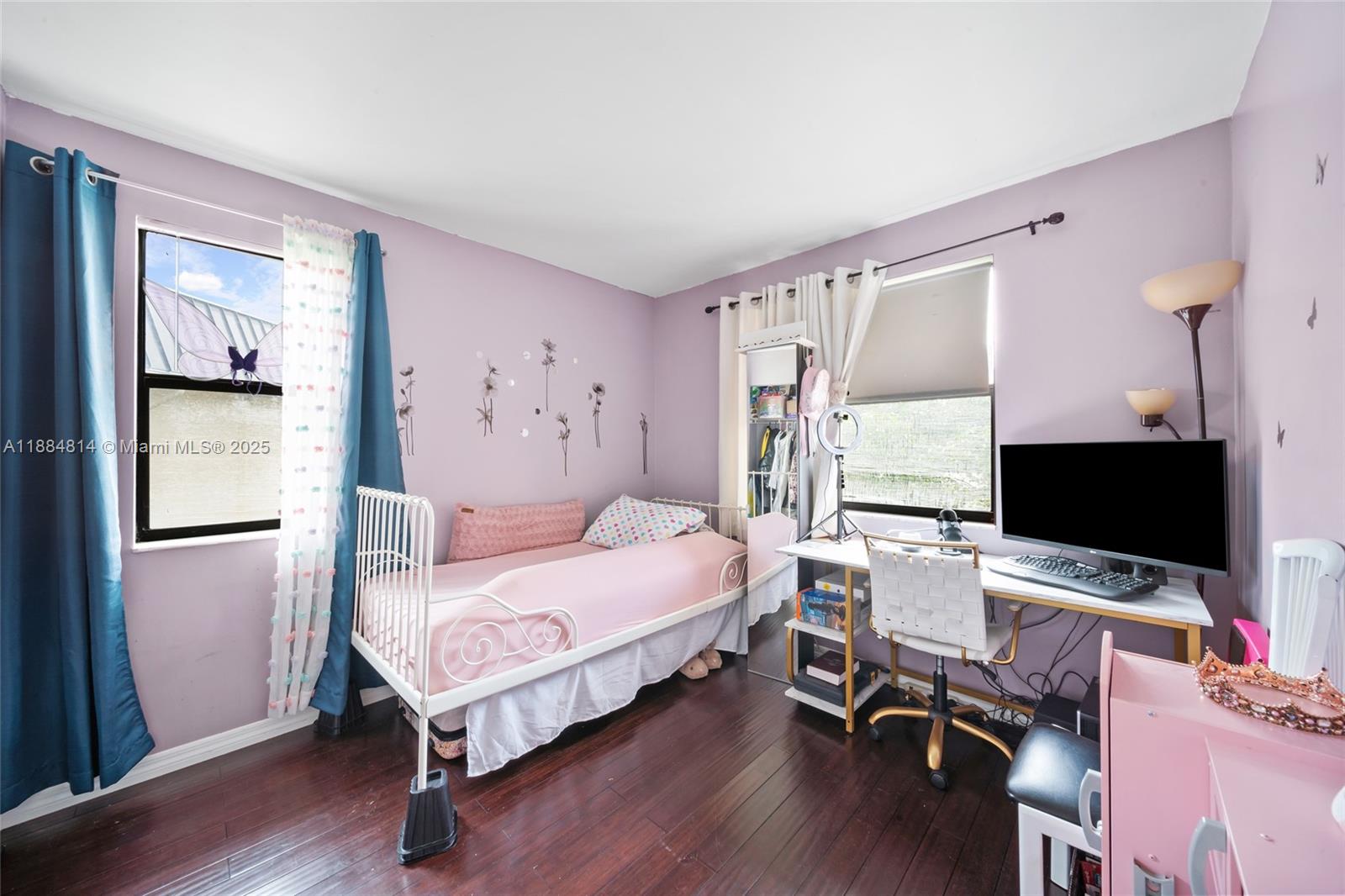 9258 Northwest 1st Street, Unit 206 Pembroke Pines, FL 33024 - Photo 15 of 22 a bedroom with a bed and a computer on a desk next to a window