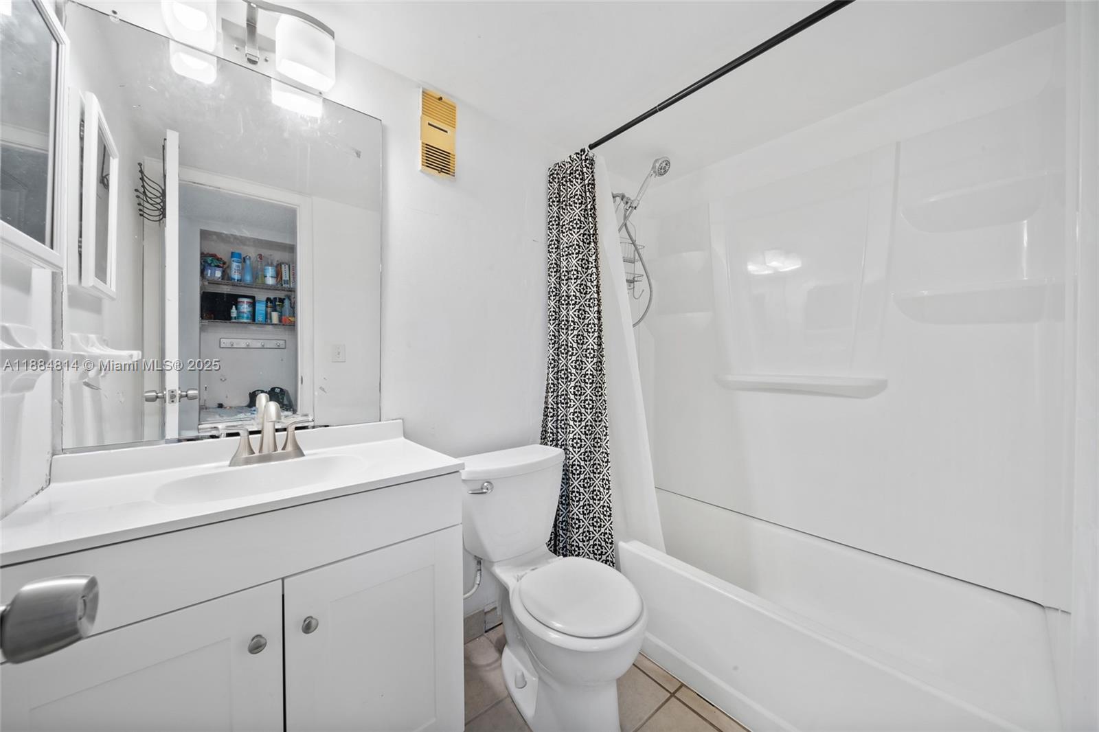 9258 Northwest 1st Street, Unit 206 Pembroke Pines, FL 33024 - Photo 16 of 22 a bathroom with a sink toilet vanity and shower