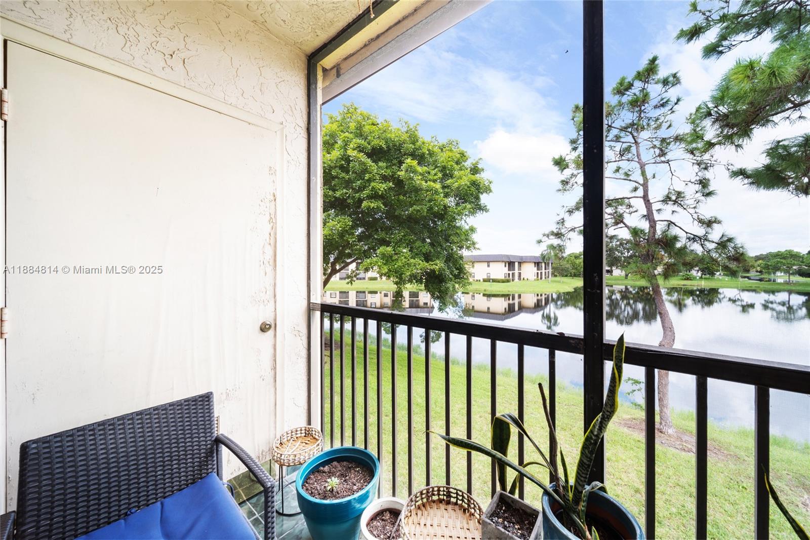 9258 Northwest 1st Street, Unit 206 Pembroke Pines, FL 33024 - Photo 17 of 22 a view of a porch with a yard