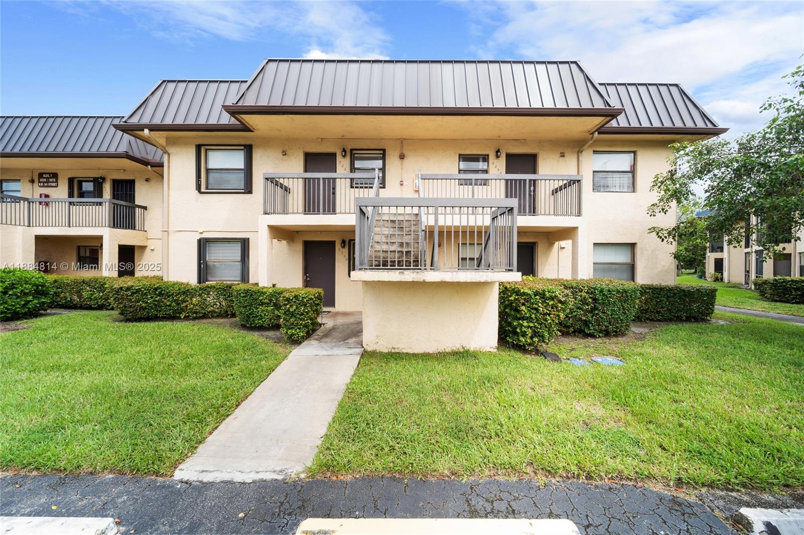 9258 Northwest 1st Street, Unit 206 Pembroke Pines, FL 33024 - Photo 19 of 22 a view of a house with garden