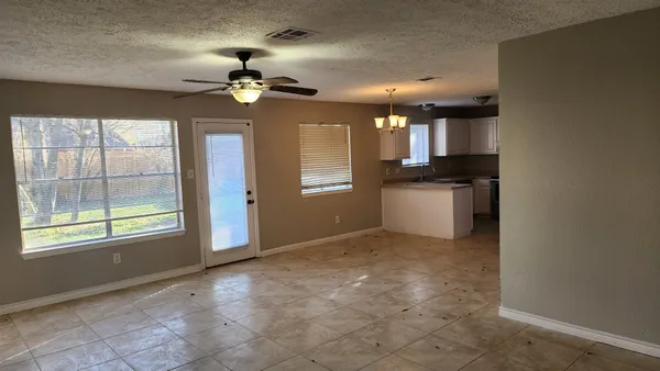 a view of an empty room with a window