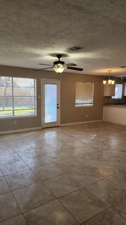 a view of an empty room and window