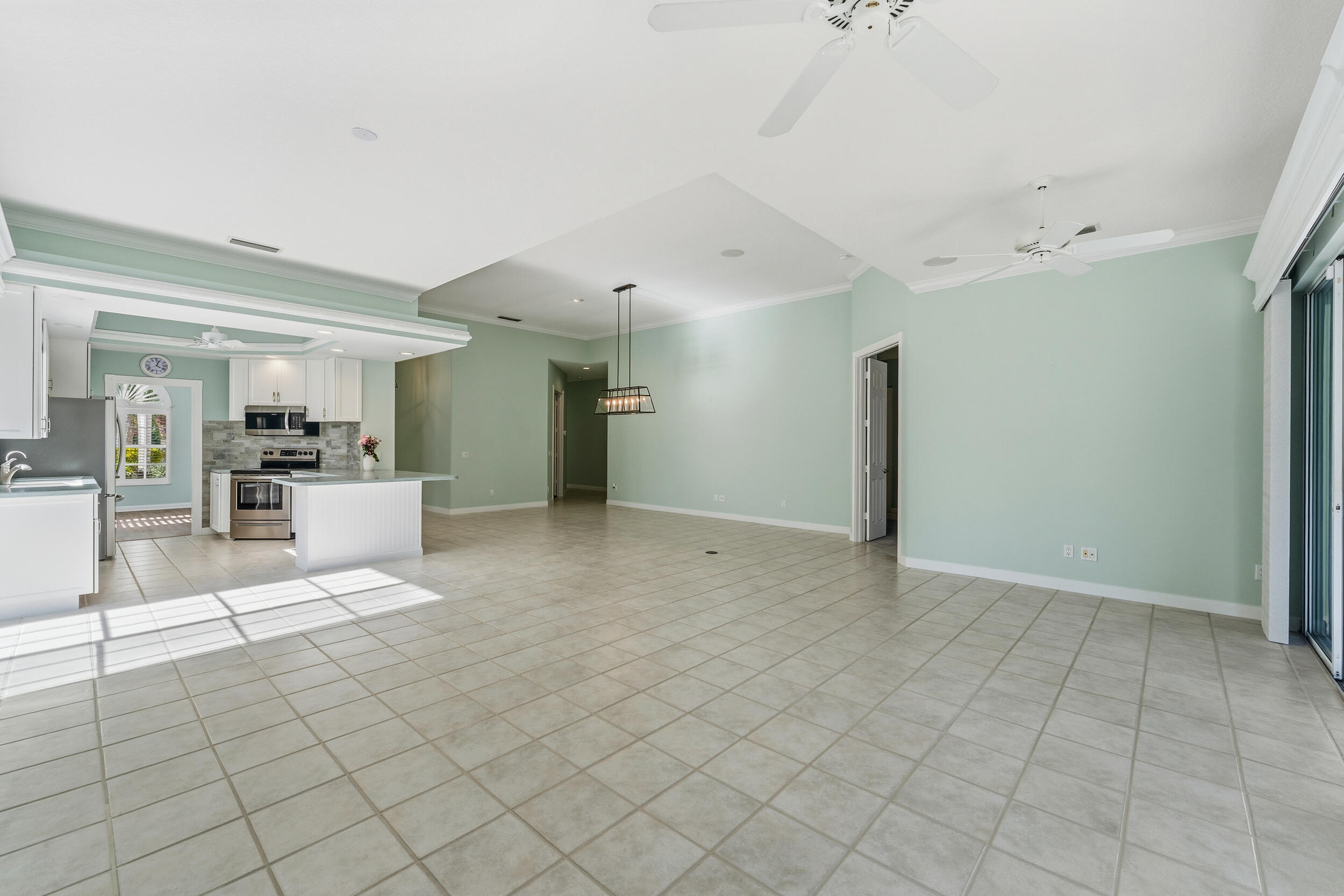 7945 Southeast Paurotis Lane Hobe Sound, FL 33455 - Photo 25 of 64 a view of kitchen with furniture and refrigerator