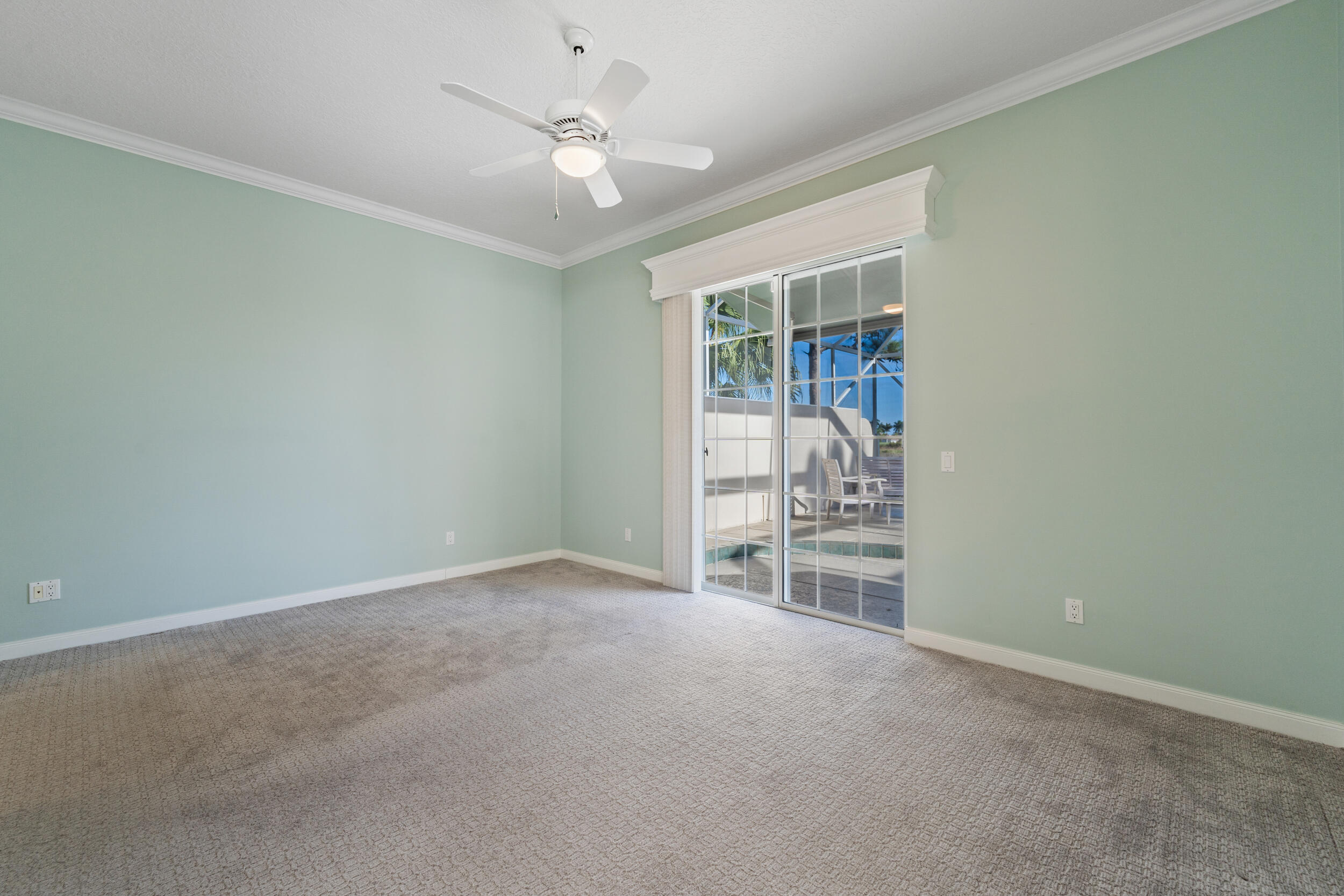 7945 Southeast Paurotis Lane Hobe Sound, FL 33455 - Photo 27 of 64 an empty room with a empty space and a ceiling fan