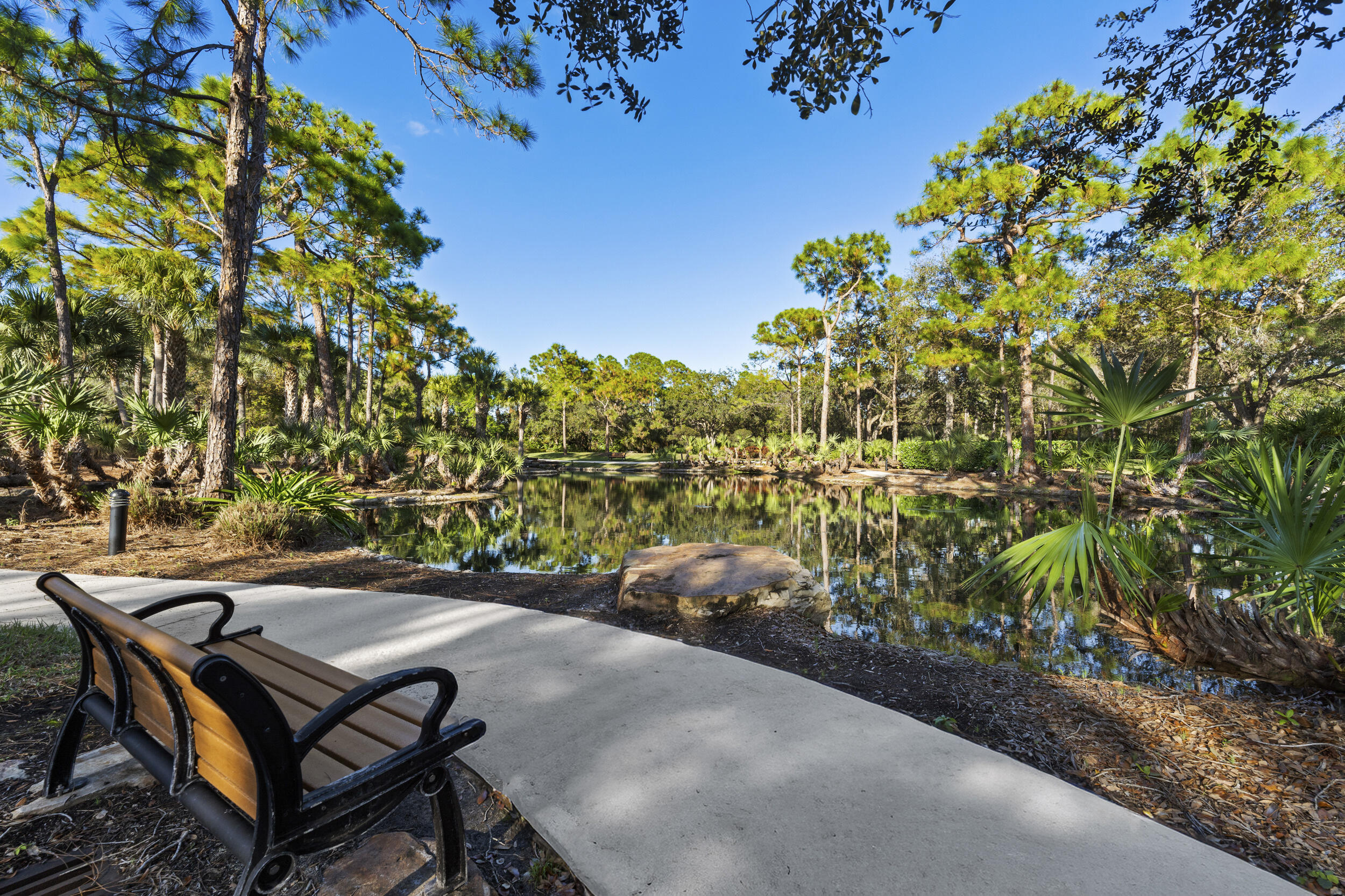 7945 Southeast Paurotis Lane Hobe Sound, FL 33455 - Photo 50 of 64 a view of a backyard with chairs