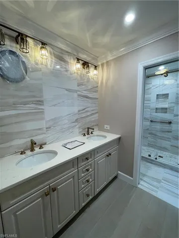 a bathroom with a double vanity sink and mirror