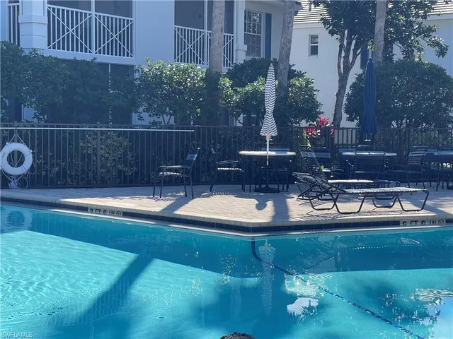 a view of swimming pool with a yard