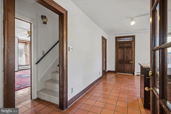 a kitchen with a sink and a refrigerator