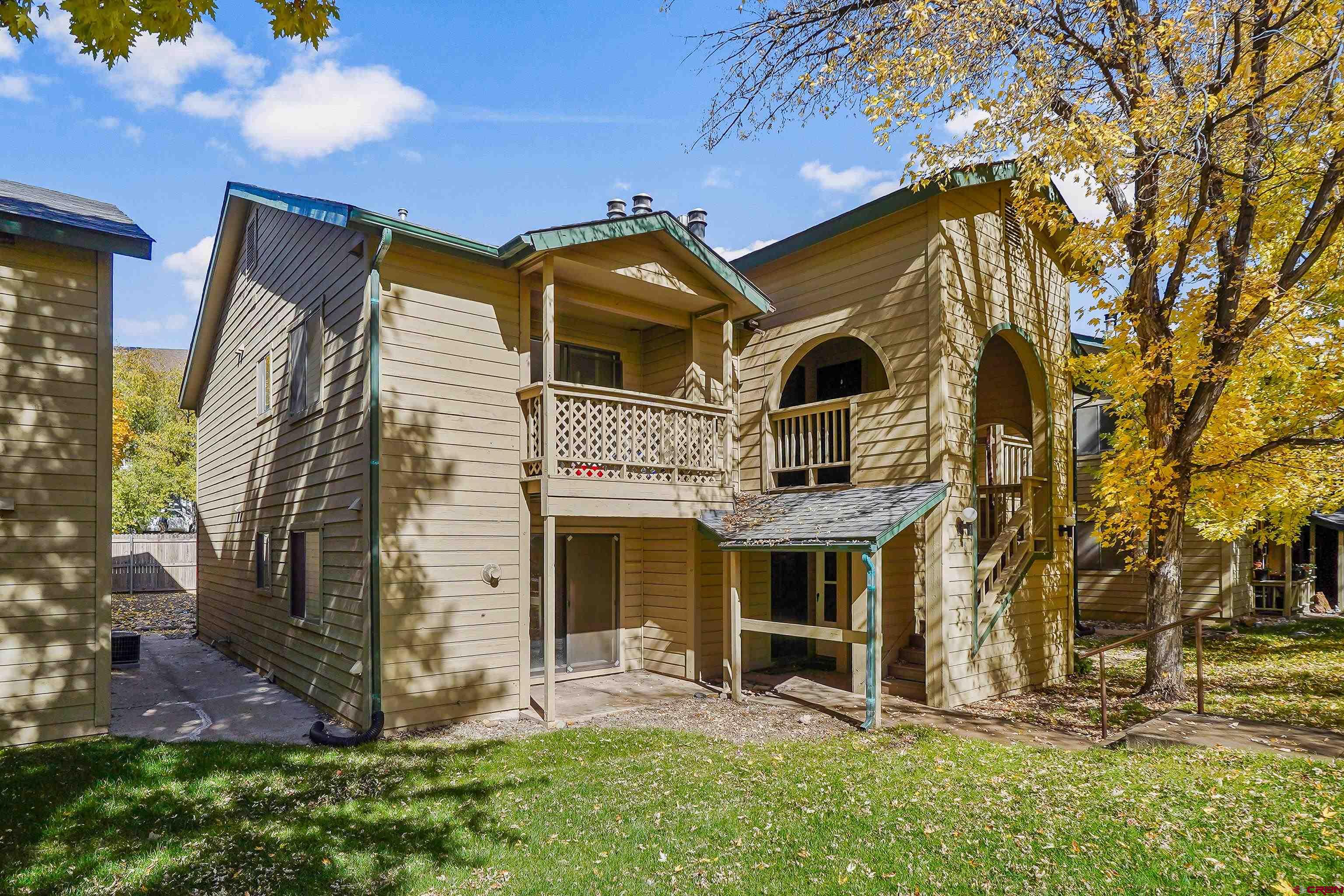 1200 Florida Road, Unit 7 Durango, CO 81301 - Photo 1 of 26 a front view of a house with garden