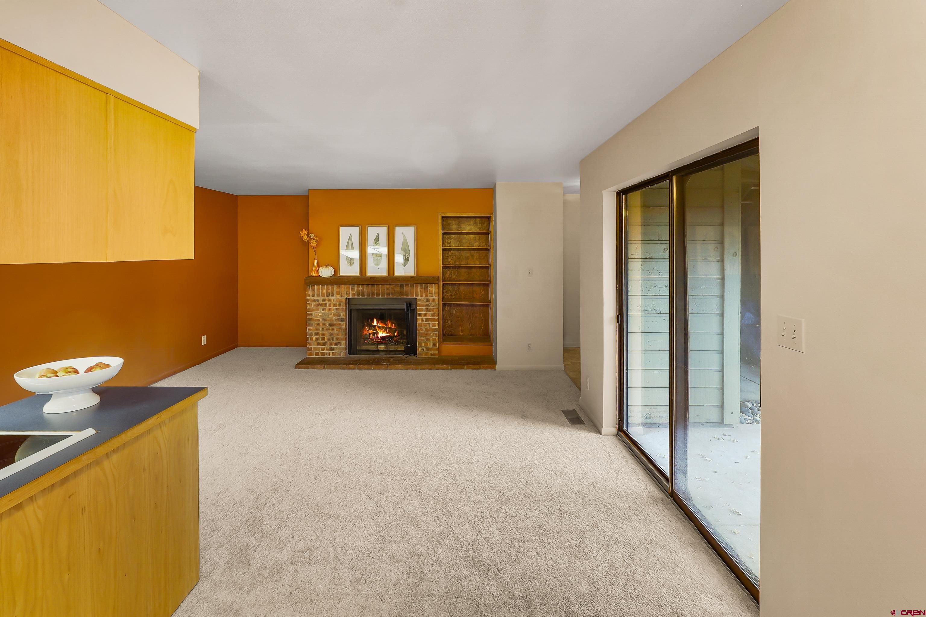 1200 Florida Road, Unit 7 Durango, CO 81301 - Photo 13 of 26 a view of an empty room with a fireplace