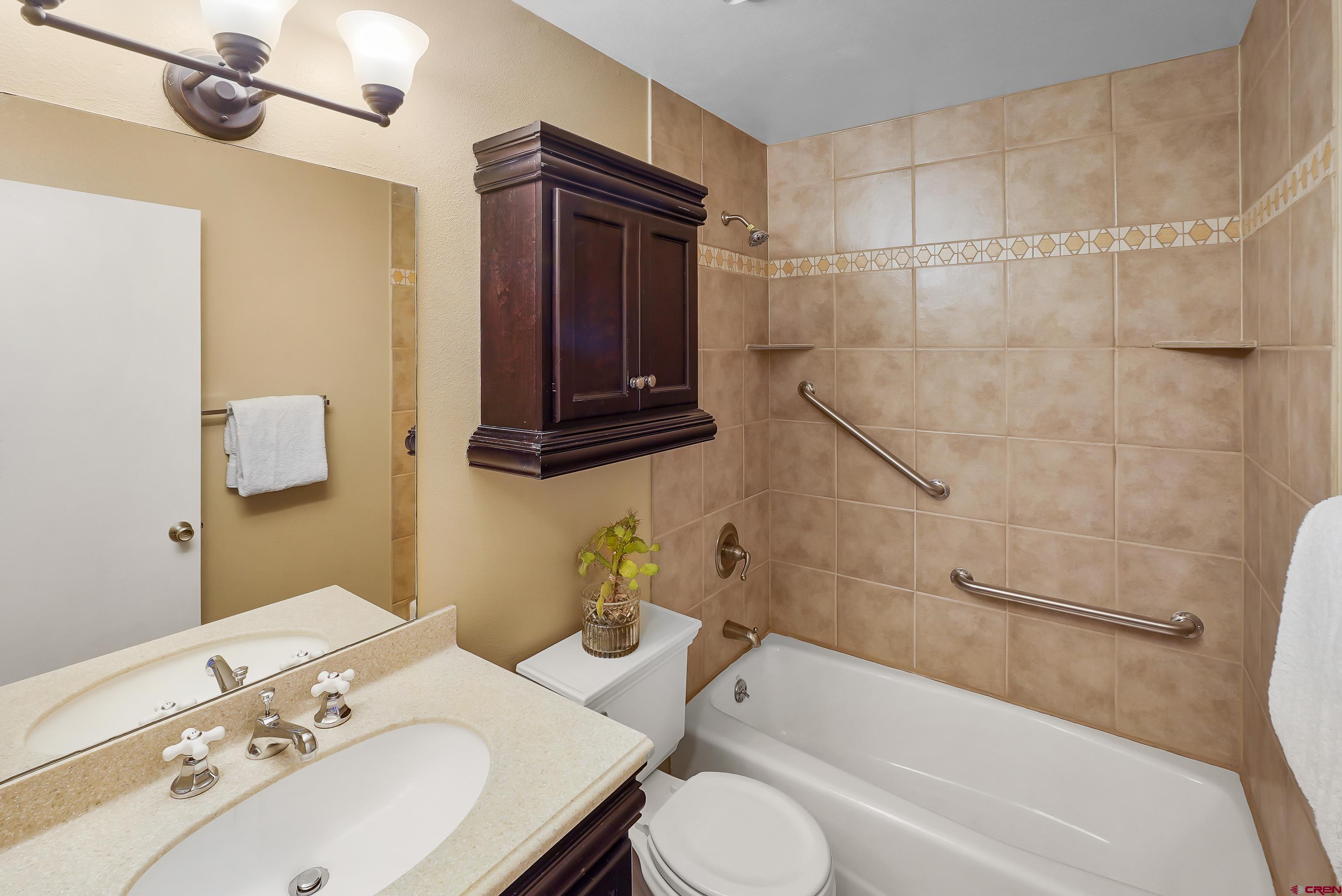 1200 Florida Road, Unit 7 Durango, CO 81301 - Photo 22 of 26 a bathroom with a sink toilet and shower