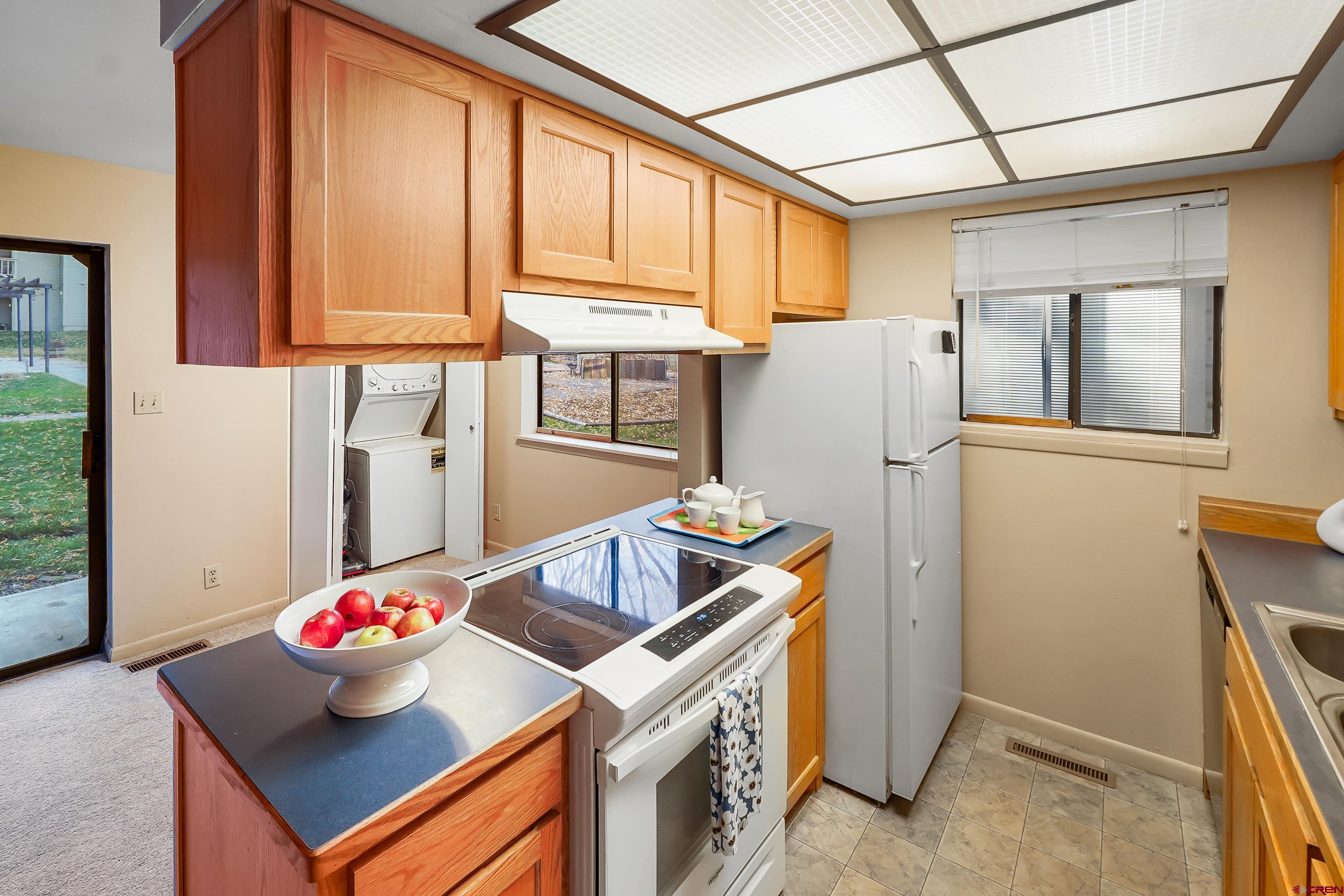 1200 Florida Road, Unit 7 Durango, CO 81301 - Photo 4 of 26 a kitchen with refrigerator and window