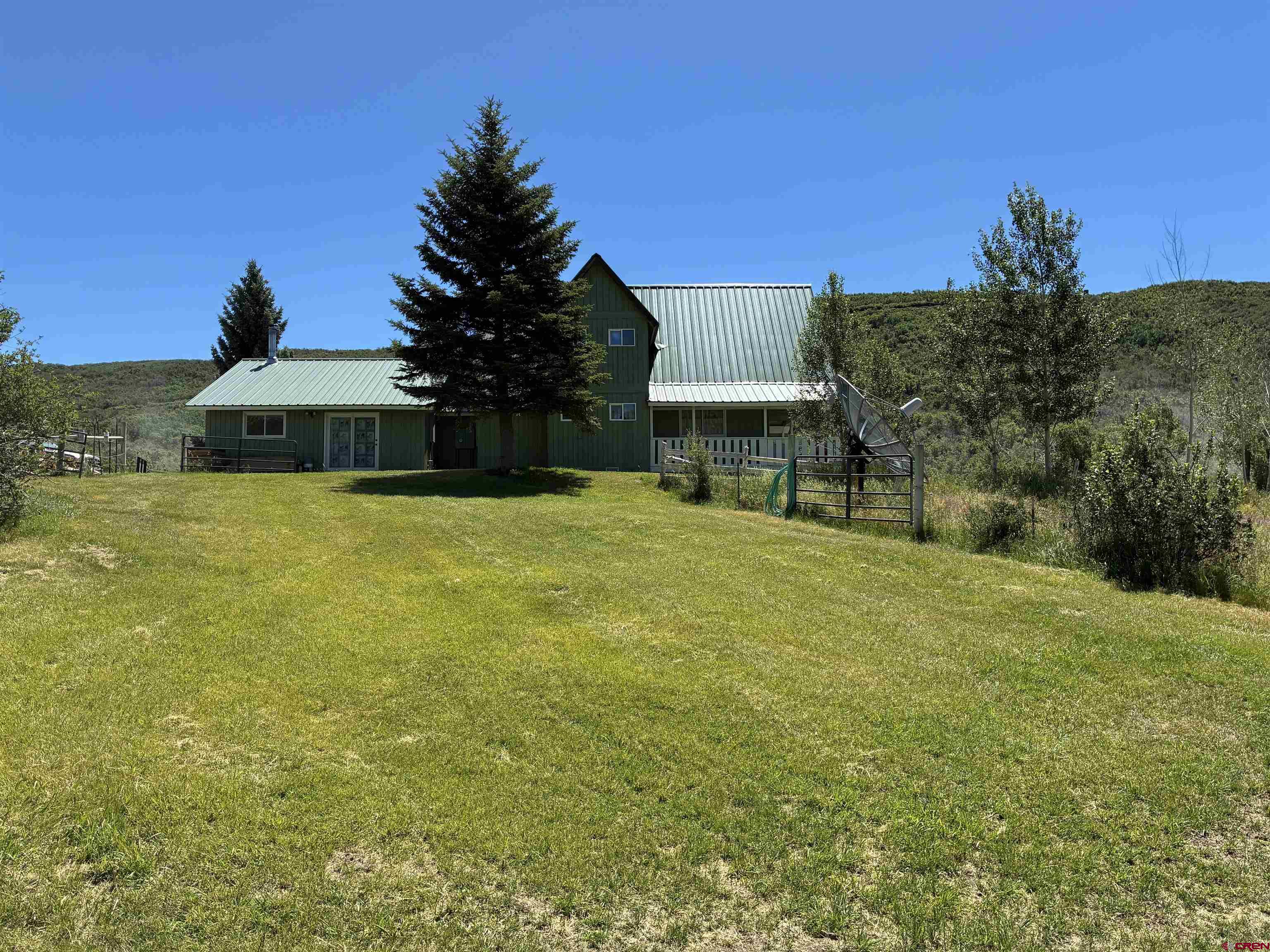 19253 Stevens Gulch Road Paonia, CO 81428 - Photo 4 of 43 a view of a house with a yard