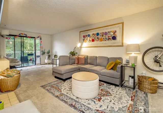 a living room with furniture and a large window