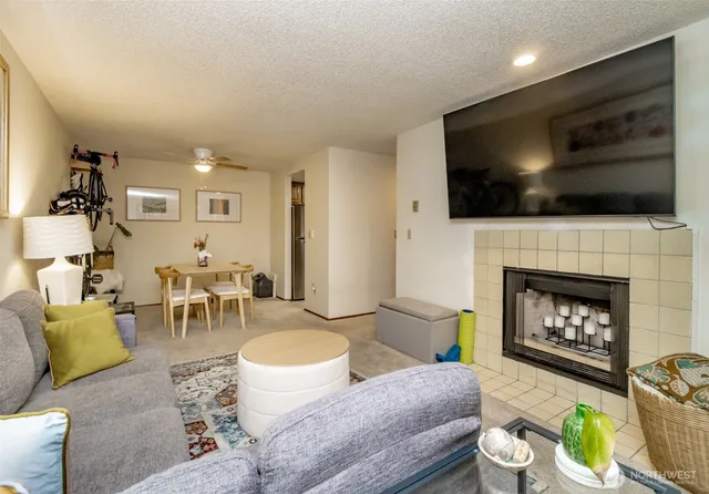 a living room with furniture and a potted plant