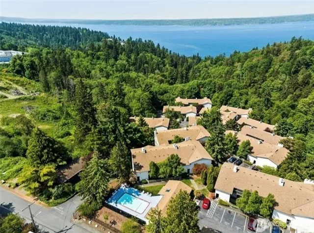 an aerial view of a house with a yard