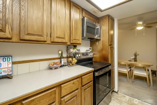 a kitchen with a sink cabinets and appliances