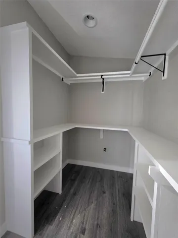 a view of an empty walk in closet