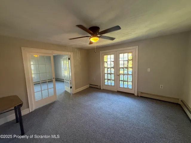 a view of an empty room with a window