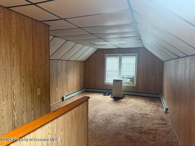 a view of a hallway with a window