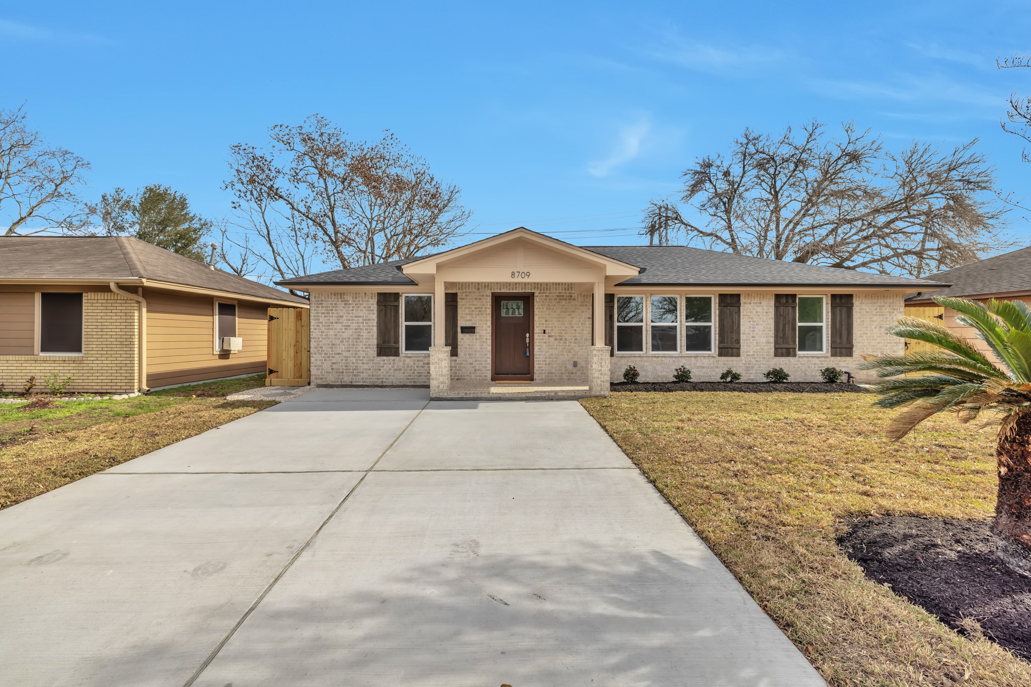 8709 Tarbell Road Houston, TX 77034 - Photo 2 of 25 front view of a house with a yard