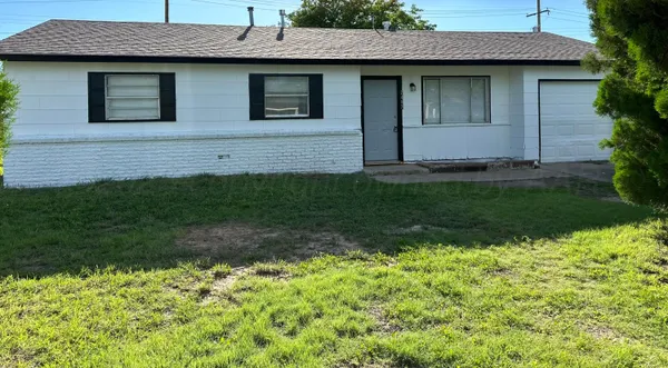 a front view of a house with a large window