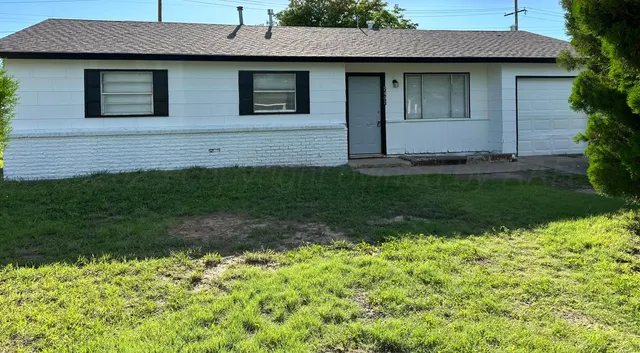 a front view of a house with a large window
