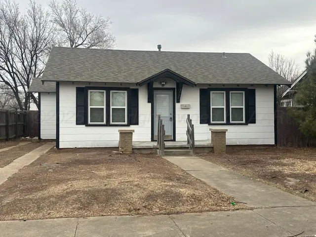 a house with trees in the background