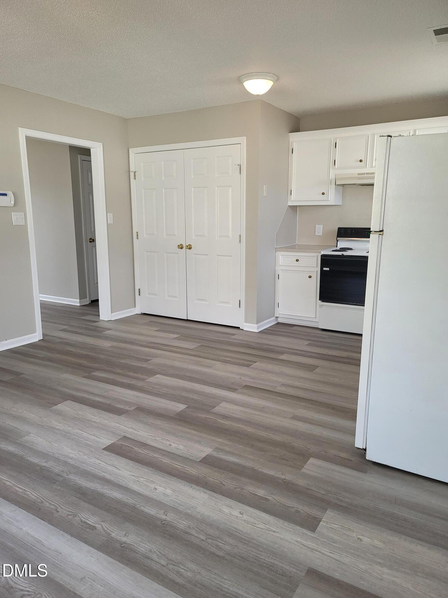 3670 Highland Drive Ayden, NC 28513 - Photo 11 of 18 a view of a kitchen with wooden floor and electronic appliances