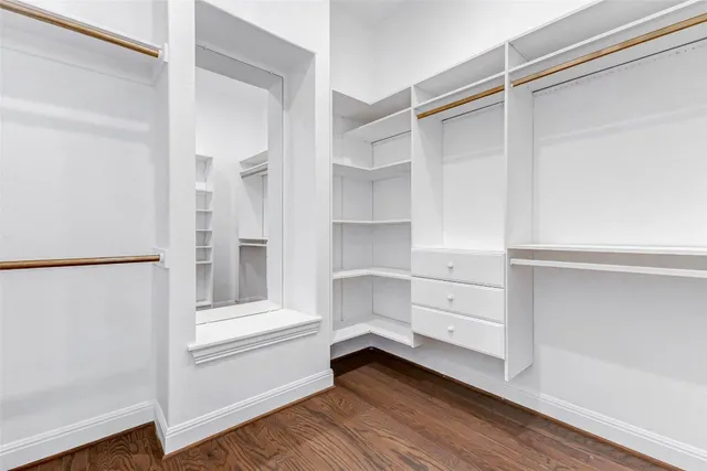 a view of a living room with wooden floor