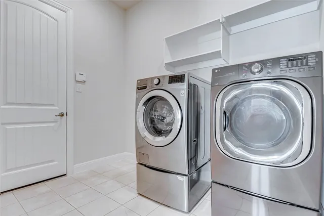 a front view of a house with yard and green space