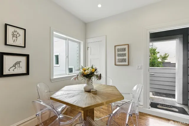 a view of a dining room with furniture window and wooden floor