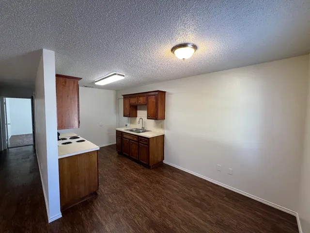 a room with furniture and wooden floor