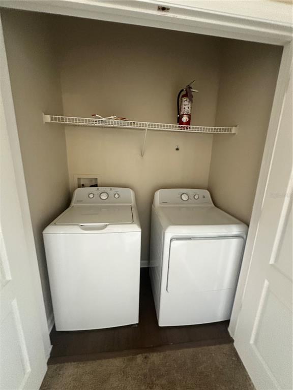 8849 Villa View Circle, Unit 306 Orlando, FL 32821 - Photo 13 of 15 a utility room with dryer and washer