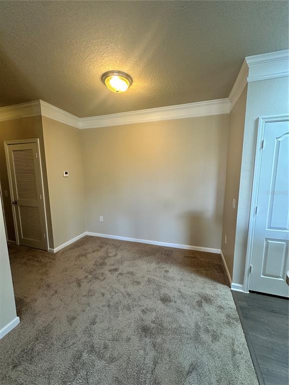 8849 Villa View Circle, Unit 306 Orlando, FL 32821 - Photo 3 of 15 an empty room with wooden door