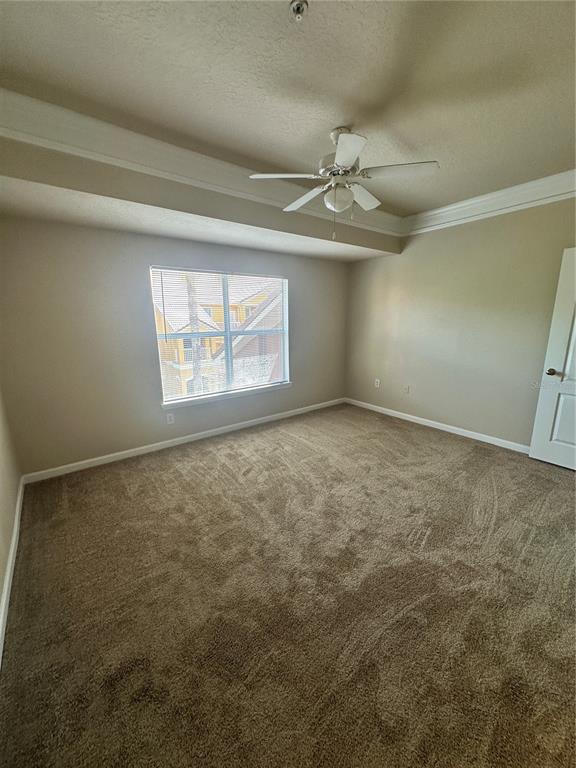 8849 Villa View Circle, Unit 306 Orlando, FL 32821 - Photo 6 of 15 an empty room with windows and ceiling fan view